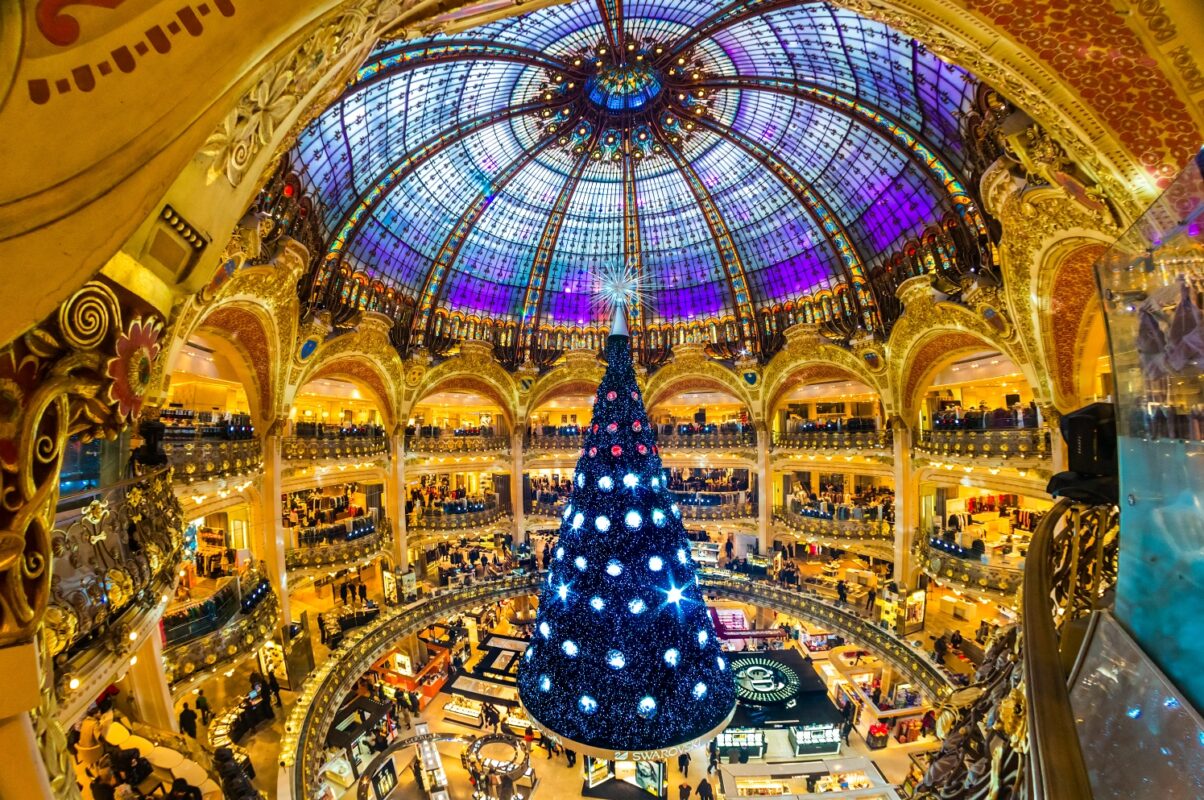 christmas tree under stained glass dome at galerie lafayette